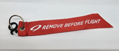 NINER BRANDED REMOVE BEFORE FLIGHT KEYCHAIN - RED