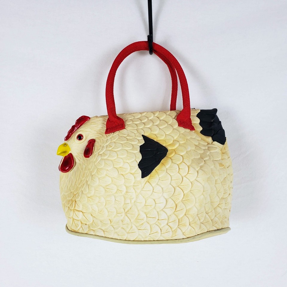 A tote bag shaped like a rubber chicken — kitsch maximalism you can actually carry your groceries in.