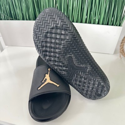 jordan sandals black and gold