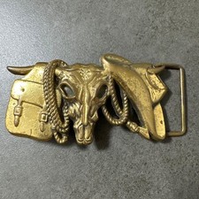 Western vintage belt buckle with western cow skull design, used