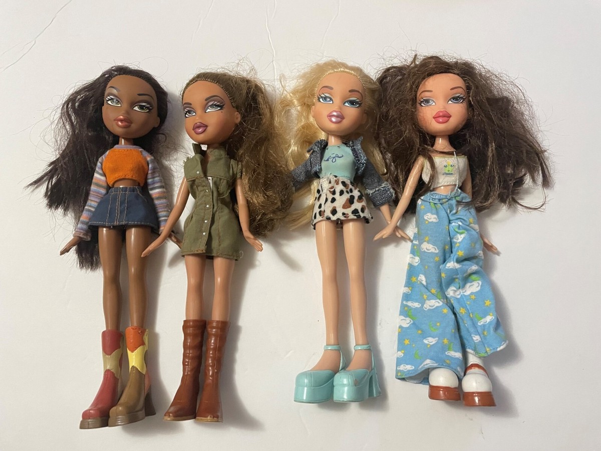 MGM BRATZ DOOLS ,7 DOLLS, 10 INCHES tall and 5 extra pair of shoes