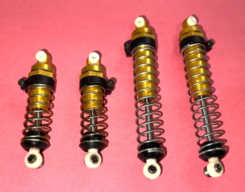 РАДИОУПРАВЛЯЕМЫЙ ПУЛЬТ ДИСТАНЦИОННОГО УПРАВЛЕНИЯ РАННИЙ ШТАМП RC10 БАГГИ НАБОР ЗОЛОТЫХ АМОРТИЗАТОРОВ БЕЗ ПРОРЕЗЕЙ ДНИЩА - Изображение 2 из 4