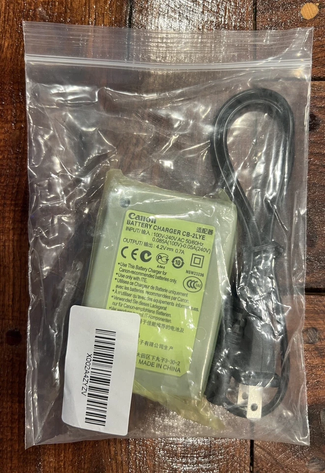 Cargador de batería Canon CB-2LYE con cable de alimentación nuevo OEM genuino Foto 3 de 4