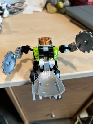   LEGO BIONICLE Three figures with weapons, plus two