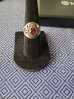 vintage-style sterling silver ring featuring a vibrant red gemstone.