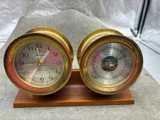 VINTAGE AIR GUIDE SHIP’S BELL QUARTZ CLOCK AND BAROMETER ON WOOD BASE
