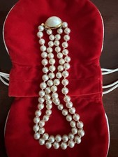 Double-strand faux pearl choker 14  , knotted and an oval pearl clasp.