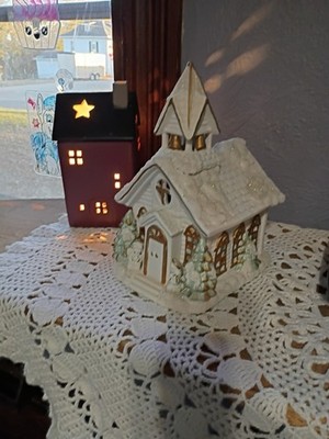 This is a ceramic lighted Christmas village church chapel