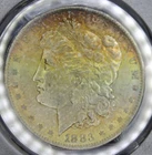1883 O Morgan Silver Dollar Rainbow Color Textile Toned Obverse PCGS Graded MS64