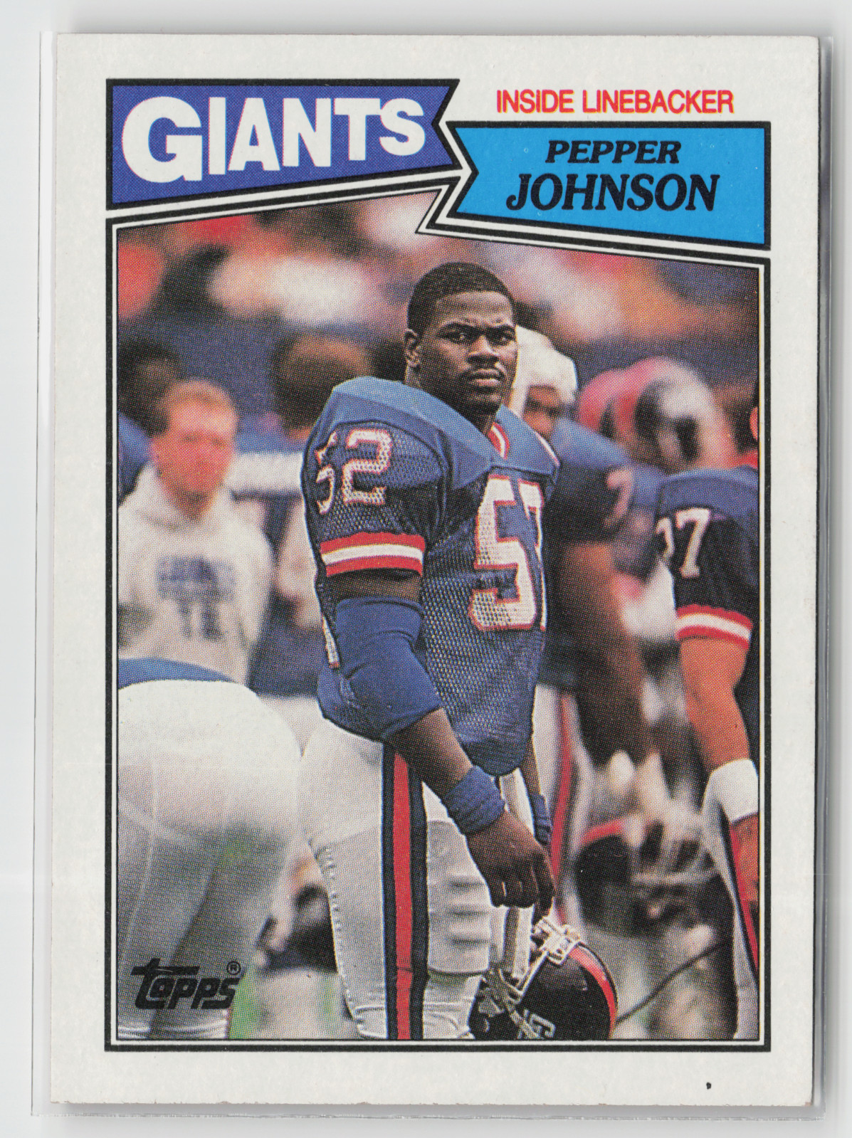 Pepper Johnson #28 Football Cards 1987 Topps trading card — raw and PSA graded price guide