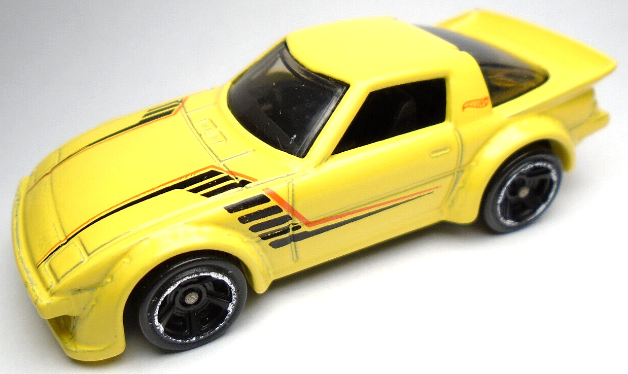 2014 HOT WHEELS MAZDA RX-7 YELLOW 1:64 DIECAST 2 5/8" CAR W/ BLACK & RED STRIPES