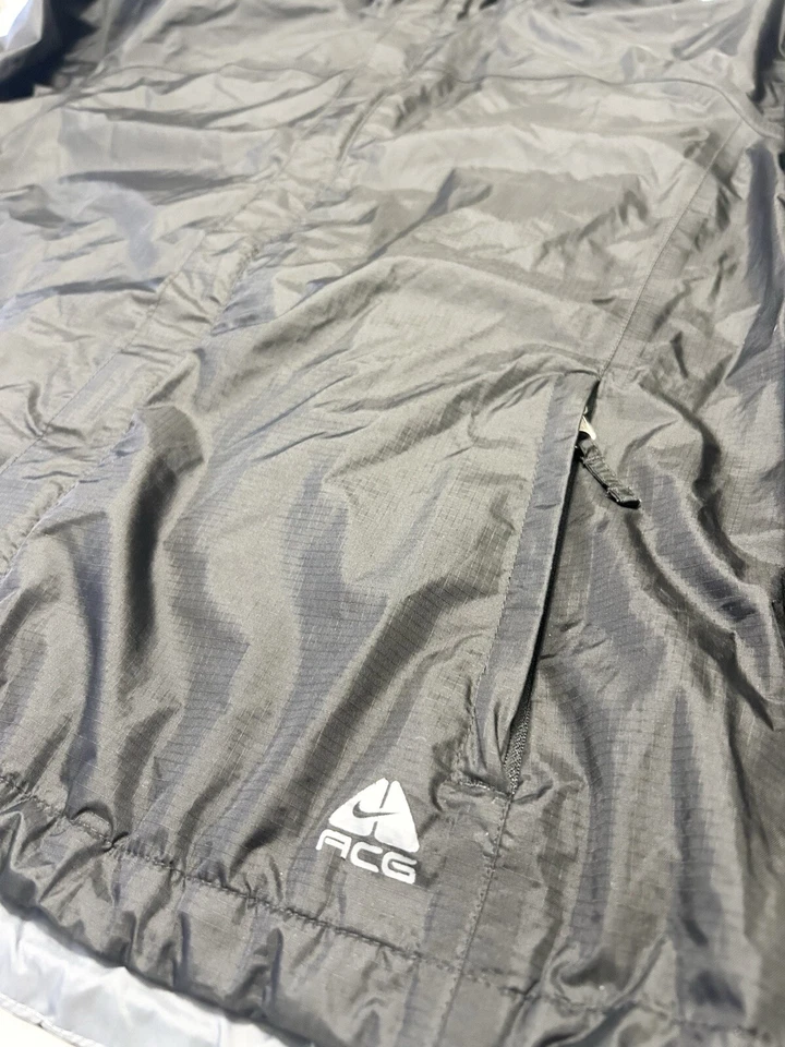Chaqueta de lluvia Nike ACG Fit Storm para mujer XL negra con logotipo de nailon con capucha cremallera completa Foto 2 de 4