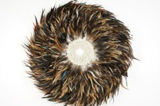 Decorazione parete Juju in piume e conchiglie