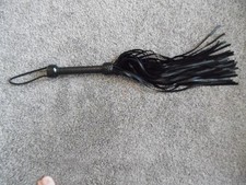 Whip flogger black leather twenty six inches long 50 strands