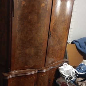 this is a French provincial style armoire or wardrobe cabinet 