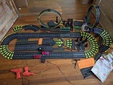 Working artin slot car set with extra pieces