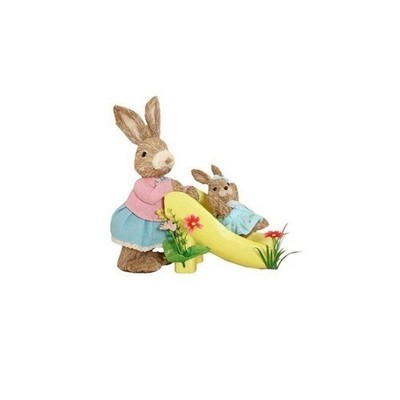 Verzauberte Osterhasen Hasen auf gelber Folie Tischplatte Frühlingsdeko