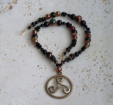 Gold Trisk pendant with Obsidian and Onyx