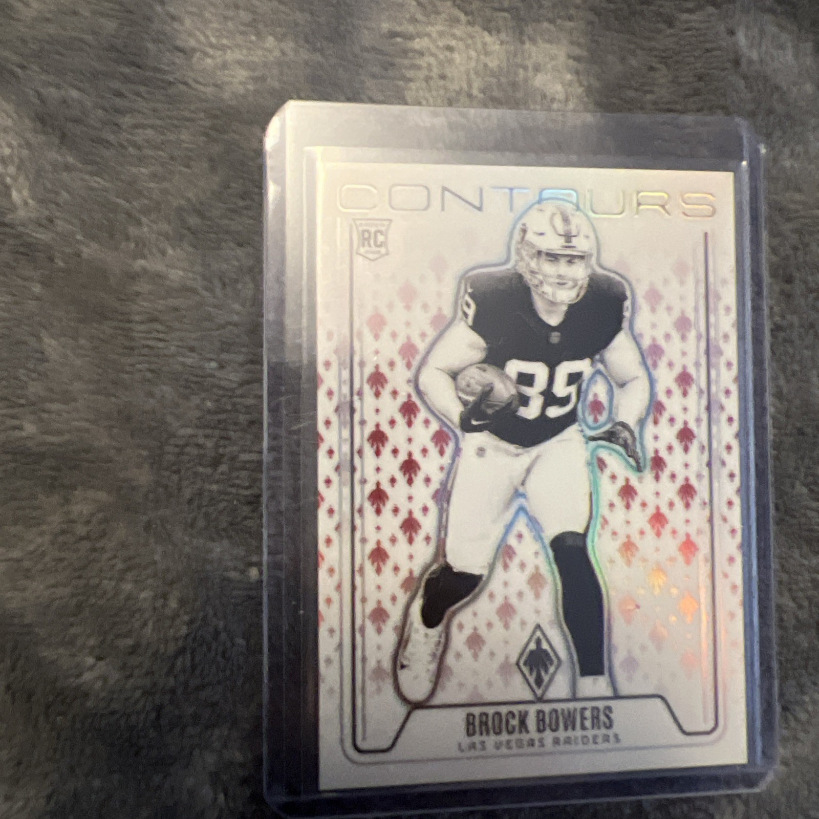 2024 Panini Phoenix - Contours Brock Bowers #CON-BBS Red /99 (RC)