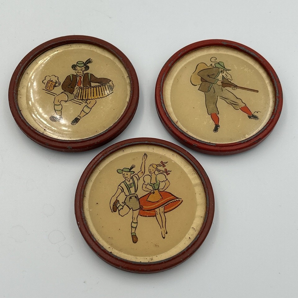 Quirky hand-painted pewter & glass coasters from the 1920s — functional antiques with actual personality and humor baked in.