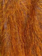 Orange Feather tinsel on mesh fabric per yard 60" wide