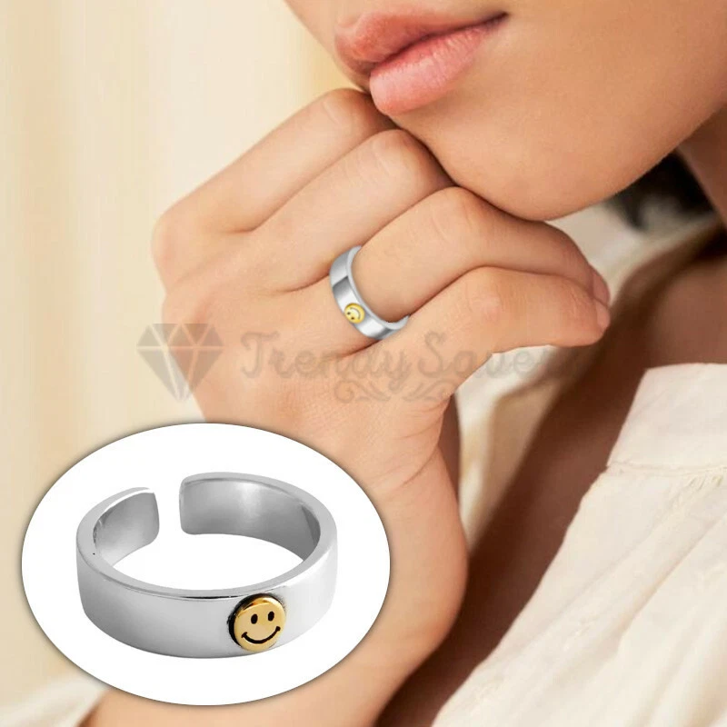 Silver ring with cheap gold smiley face