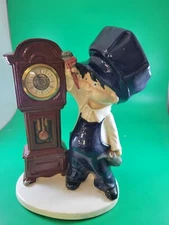 BYRON MOLDS CERAMIC BOY GRANDFATHER CLOCK FIGURINE DARK BLUE and WHITE CLOTHES