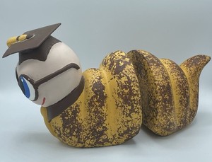 Vintage Bookend Of A “Bookworm” In Yellow & Brown Sponge Blue Eyes Grad Hat