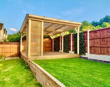 Freestanding wooden pergola with optional decking and sides