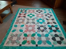 NEW HANDMADE TWIN QUILT. PROFESSIONALLY QUILTED
