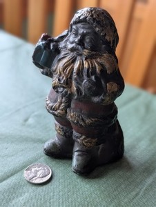 Vintage/Antique Cast Lead Santa Figurine, holding gift 4+ lbs