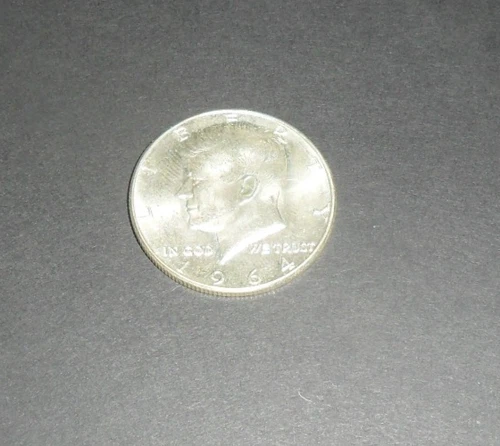 One 1964 90% Silver Kennedy Half Dollar.  Good Luster.
