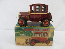 Nomura T.N. Japan Tin Litho Battery Operated Grand-pa Car w/ Lights  Smoke New 