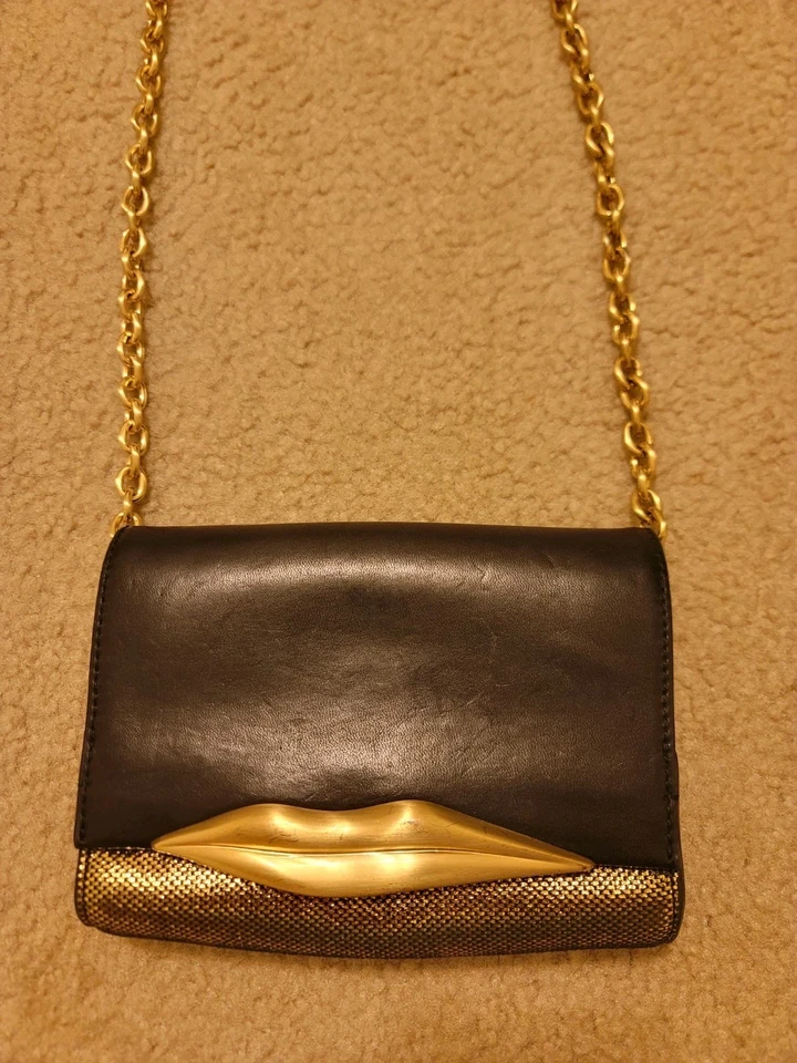 Bolso clutch de cuero Diane Von Furstenberg buen estado negro/dorado Carolina Lips Foto 2 de 4