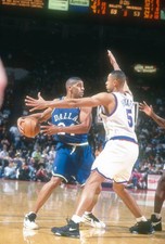 Jim Jackson Dallas Mavericks looks to pass the ball over Juwan How- Old Photo