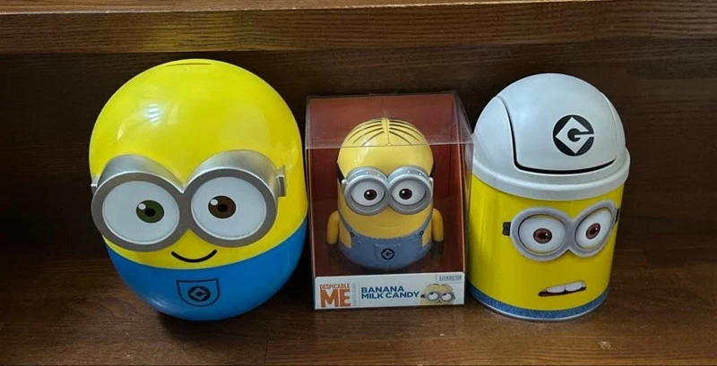 Minion figures and rising minion piggy banks and trash cans