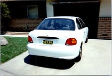1990s White Hyundai Accent Car Parked In Driveway Serpa Dealer Vintage Photo
