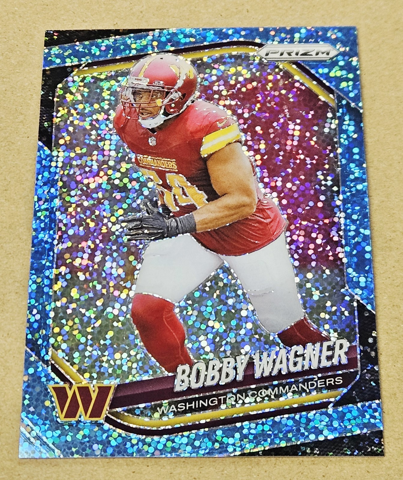 2025 Panini Prizm Bobby Wagner Light Blue Prizm Sparkle #d 63/96 Commanders #261