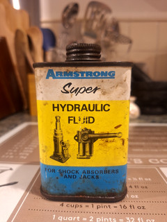 ARMSTRONG SUPER HYDRAULIC SHOCK ABSORBER FLUID GARAGE MOTOR ADVERTISING CAN TIN