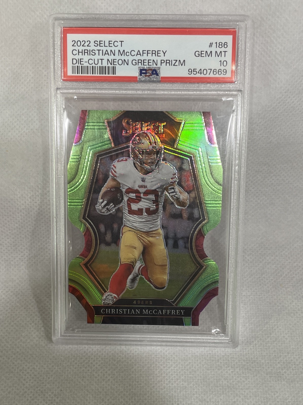 2022 Select - Premier Level Christian McCaffrey #186 Neon Green  Die-Cut /299