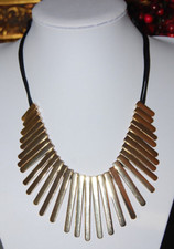 KENNETH COLE LARGE BOLD RUNWAY GOLD TONED METAL BARS ON LEATHER CORD NECKLACE