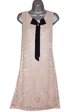 Plus size lace dress with broach detail 