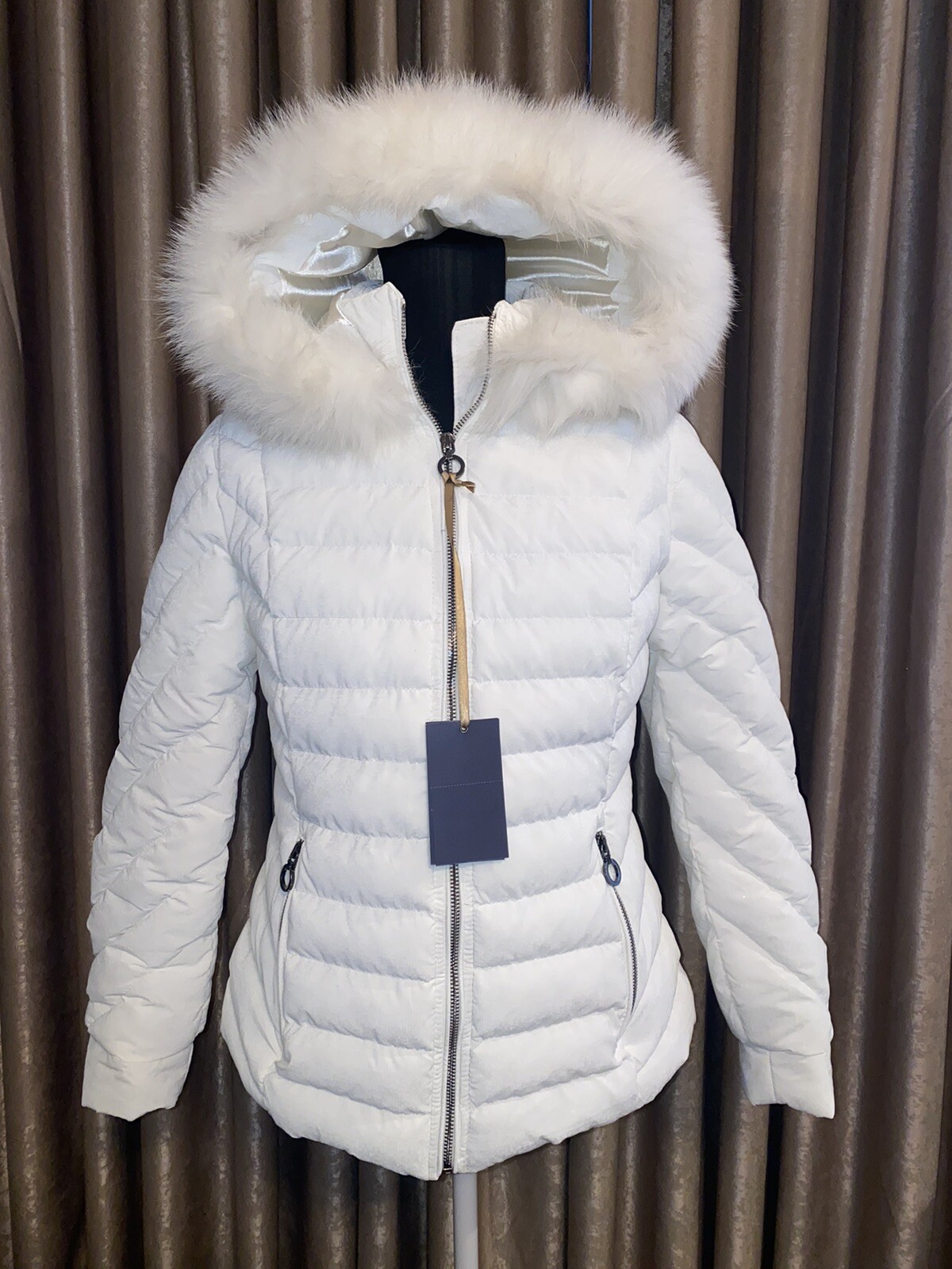 black puffer jacket with white fur hood