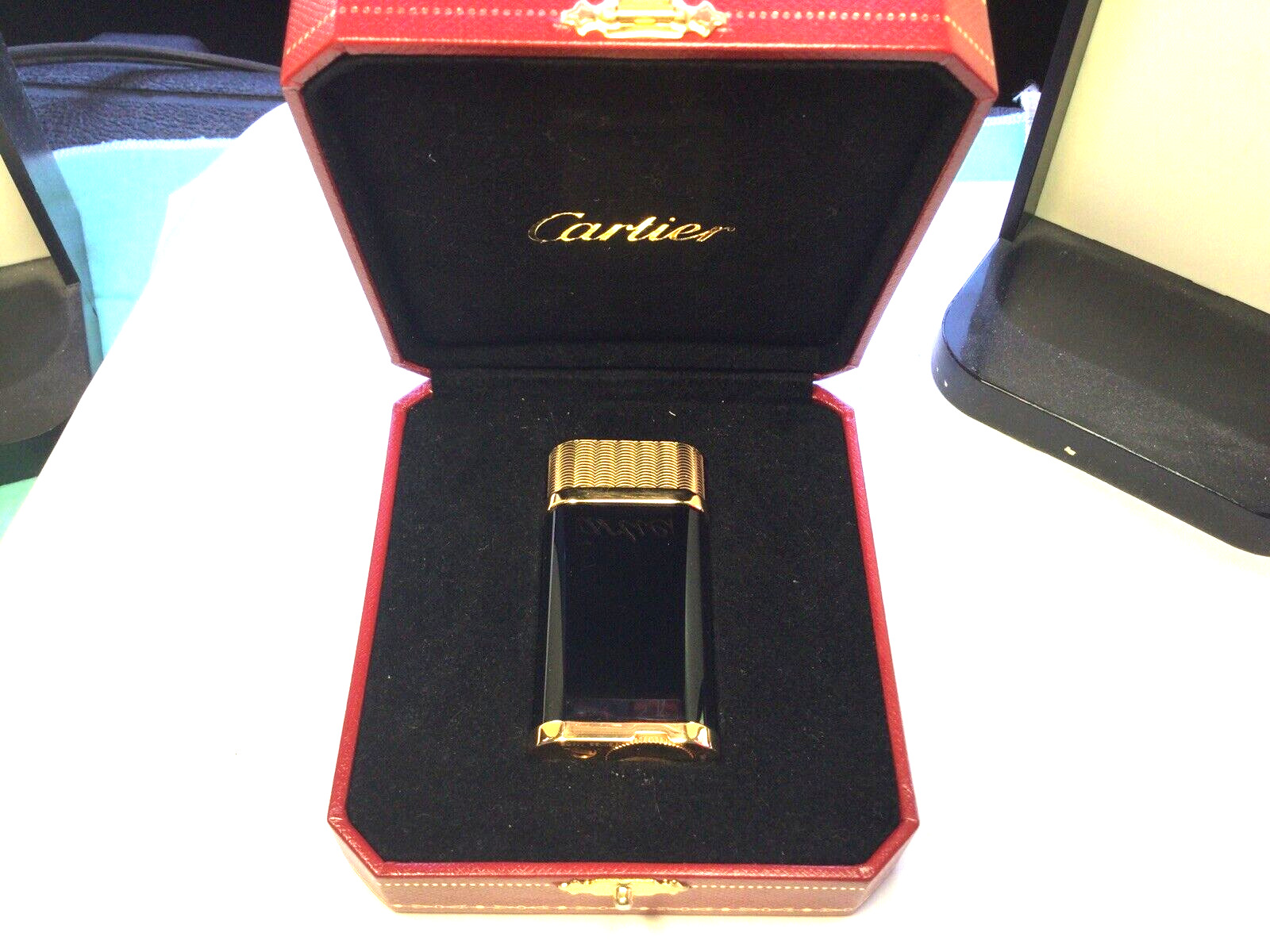 CARTIER OVAL GUILLOCHE BLACK DECOR LIGHTER W/ BOX!. Available Now for 250.00