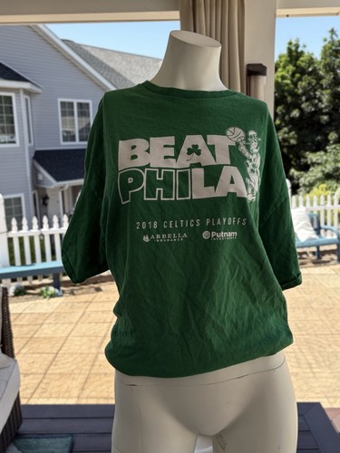 Green Boston Celtics 2018 playoffs t-shirt with white text and graphic