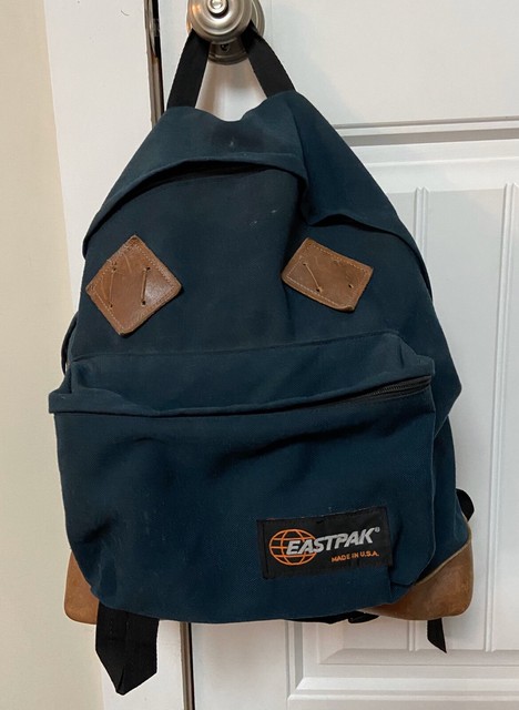 eastpak leather bottom backpack