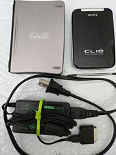 SONY CLIE PEG-SJ33/U AC Charger, Dongle Connector Clip and PEGA-KB11 Key Board.