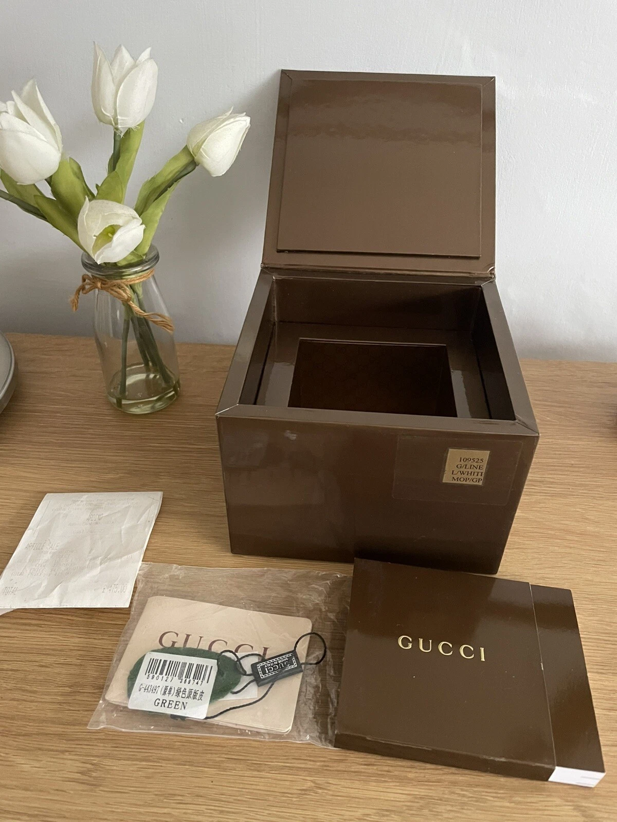 Montre Gucci marron et or boîte cadeau extérieure, livret et étiquette uniquement