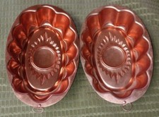Two Copper Toned Round Sunshine Molds