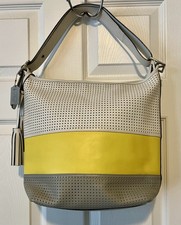 Coach colorblock perforated shoulder bag w/ tassel, bag charm, yellow gray white